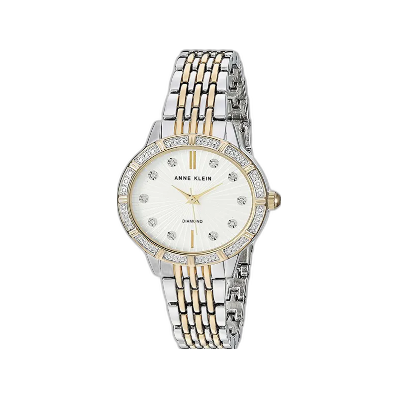 Model ANNE KLEIN 32MM AK-2783SVTT to klasyczny zegarek z subtelnymi, eleganckimi detalami, który doskonale uzupełni każdą stylizację. Tarcza w kolorze srebrnym ozdobiona została błyszczącymi indeksami, a dodatkowo obramowana pierścieniem zdobionym cyrkoniami, które nadają zegarkowi wyjątkowego blasku. Dwukolorowa bransoleta (srebro i złoto) wykonana z wysokiej jakości materiałów podkreśla luksusowy charakter modelu. Idealny dla kobiet ceniących styl i funkcjonalność w jednym akcesorium.