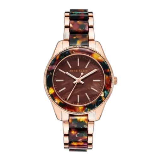 Model ANNE KLEIN 37MM AK-3214BNRG to wyrazisty zegarek damski, który łączy klasykę z unikalnym stylem. Koperta i bransoleta w odcieniu różowego złota doskonale komponują się z tarczą w głębokim brązie, nadając zegarkowi ciepły i luksusowy wygląd. Ramka ozdobiona kolorowym motywem tortoiseshell dodaje modelowi wyjątkowego charakteru, czyniąc go idealnym dodatkiem zarówno na co dzień, jak i na wyjątkowe okazje.