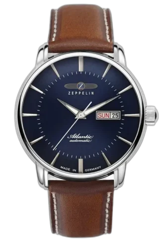 Elegancki zegarek Zeppelin Atlantic 8466-3 Automatik z granatową tarczą, smukłymi wskazówkami i minimalistycznymi indeksami. Wyposażony w funkcję automatycznego kalendarza z wyświetlaczem dnia tygodnia i daty przy godzinie 3. Stalowa koperta harmonizuje z brązowym skórzanym paskiem, zapewniając stylowy wygląd. Wyprodukowany w Niemczech, stanowi idealny wybór dla miłośników klasycznej elegancji i precyzyjnego zegarmistrzostwa.