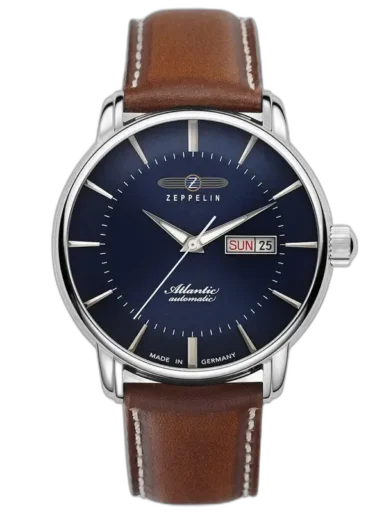 Elegancki zegarek Zeppelin Atlantic 8466-3 Automatik z granatową tarczą, smukłymi wskazówkami i minimalistycznymi indeksami. Wyposażony w funkcję automatycznego kalendarza z wyświetlaczem dnia tygodnia i daty przy godzinie 3. Stalowa koperta harmonizuje z brązowym skórzanym paskiem, zapewniając stylowy wygląd. Wyprodukowany w Niemczech, stanowi idealny wybór dla miłośników klasycznej elegancji i precyzyjnego zegarmistrzostwa.