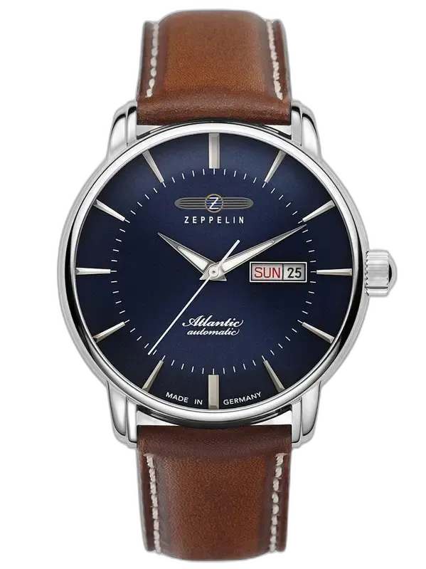 Elegancki zegarek Zeppelin Atlantic 8466-3 Automatik z granatową tarczą, smukłymi wskazówkami i minimalistycznymi indeksami. Wyposażony w funkcję automatycznego kalendarza z wyświetlaczem dnia tygodnia i daty przy godzinie 3. Stalowa koperta harmonizuje z brązowym skórzanym paskiem, zapewniając stylowy wygląd. Wyprodukowany w Niemczech, stanowi idealny wybór dla miłośników klasycznej elegancji i precyzyjnego zegarmistrzostwa.