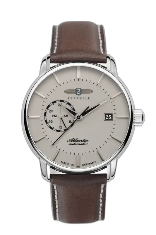Zegarek Zeppelin Atlantic 8470-5 z klasyczną beżową tarczą i elegancką stalową kopertą. Wyposażony w funkcję datownika oraz 24-godzinną sub-tarczę. Brązowy skórzany pasek z subtelnymi przeszyciami podkreśla ponadczasowy charakter tego automatycznego zegarka, nawiązującego do morskiego dziedzictwa kolekcji Atlantic.