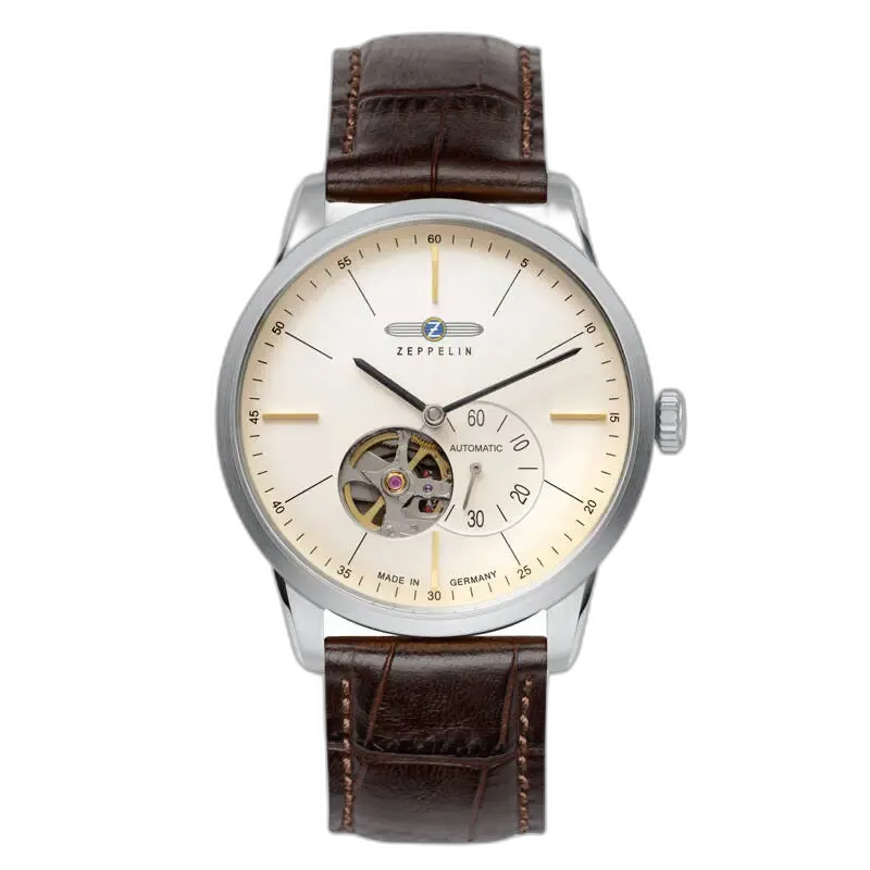 Stylowy zegarek Zeppelin Flatline 7364-5 Automatik z minimalistyczną kremową tarczą i widocznym mechanizmem typu open-heart na godzinie 7. Wyposażony w smukłe wskazówki, subtelne indeksy oraz wskaźnik sekundowy. Elegancki brązowy pasek skórzany dopełnia klasyczny niemiecki design.