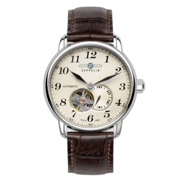 Wyrafinowany zegarek Zeppelin LZ127 7666-5 Automatik z kremową tarczą i widocznym mechanizmem typu open-heart na godzinie 7. Czasomierz wyposażony w wyraźne cyfry arabskie oraz brązowy skórzany pasek z eleganckimi przeszyciami. Niemiecki design łączy klasykę z nowoczesną technologią automatycznego mechanizmu.