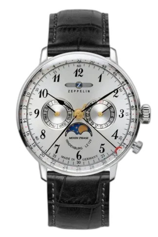 Zegarek męski Zeppelin LZ129 Hindenburg 7036-1 z białą tarczą i eleganckim czarnym skórzanym paskiem. Wyposażony w funkcję faz księżyca, datownik oraz wskaźnik dnia tygodnia. Styl klasyczny z precyzyjnymi czarnymi indeksami i złotymi akcentami. Wykonany w Niemczech, idealny dla miłośników ponadczasowej elegancji.
