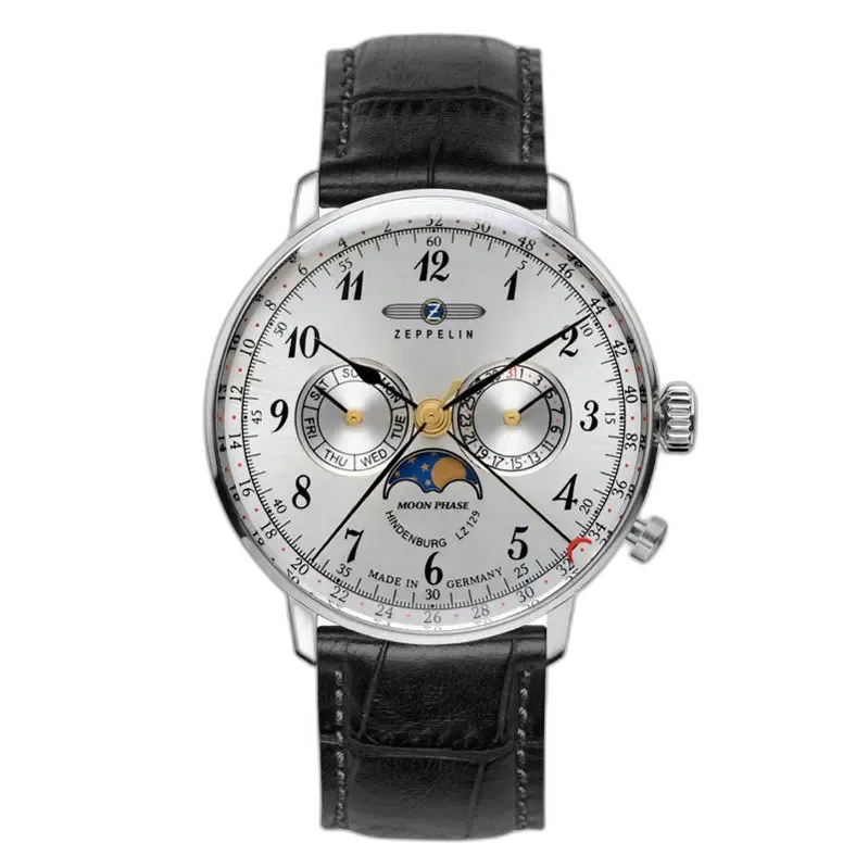 Zegarek męski Zeppelin LZ129 Hindenburg 7036-1 z białą tarczą i eleganckim czarnym skórzanym paskiem. Wyposażony w funkcję faz księżyca, datownik oraz wskaźnik dnia tygodnia. Styl klasyczny z precyzyjnymi czarnymi indeksami i złotymi akcentami. Wykonany w Niemczech, idealny dla miłośników ponadczasowej elegancji.