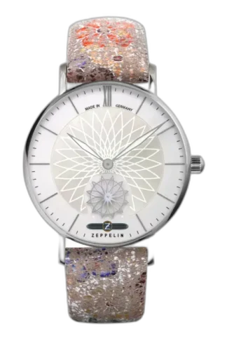 Stylowy zegarek Zeppelin Mandala 8131-1, charakteryzujący się wyjątkową tarczą z motywem mandali w kolorze srebrnym. Wyjątkowy pasek z oryginalnym, artystycznym wzorem dodaje mu unikalnego charakteru. Perfekcyjne połączenie precyzji niemieckiej produkcji z niepowtarzalnym designem.