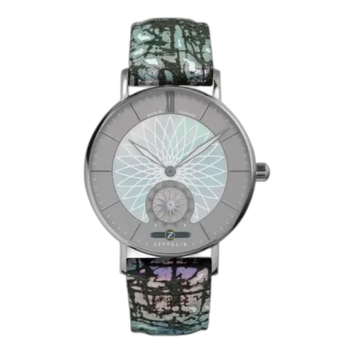 Wyjątkowy zegarek Zeppelin Mandala 8131-3 z unikalnym geometrycznym wzorem na srebrzystej tarczy, inspirowanym motywami mandali. Wyróżnia się niepowtarzalnym, wielobarwnym paskiem o artystycznym designie. Koperta wykonana z wysokiej jakości stali szlachetnej podkreśla nowoczesny i stylowy charakter zegarka. Precyzja wykonania w połączeniu z oryginalnym wzornictwem to esencja marki Zeppelin.
