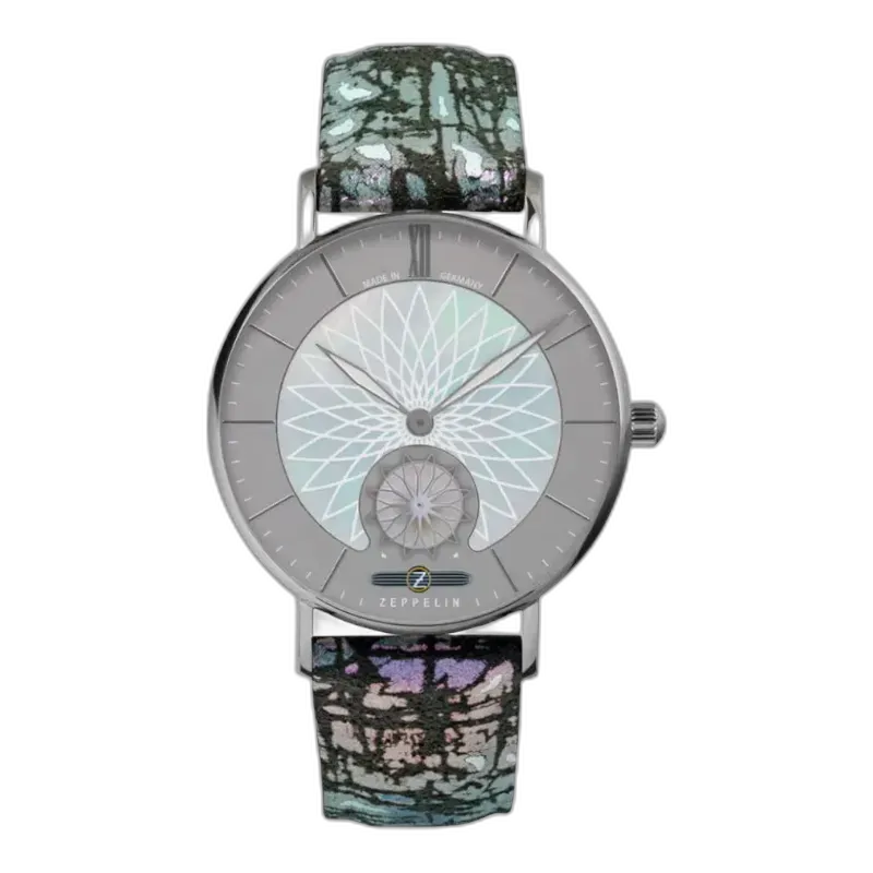 Wyjątkowy zegarek Zeppelin Mandala 8131-3 z unikalnym geometrycznym wzorem na srebrzystej tarczy, inspirowanym motywami mandali. Wyróżnia się niepowtarzalnym, wielobarwnym paskiem o artystycznym designie. Koperta wykonana z wysokiej jakości stali szlachetnej podkreśla nowoczesny i stylowy charakter zegarka. Precyzja wykonania w połączeniu z oryginalnym wzornictwem to esencja marki Zeppelin.