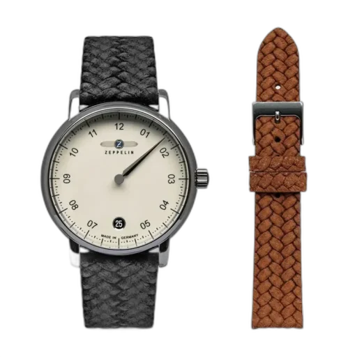 Zegarek Zeppelin New Captain’s Line 8643-5 z minimalistyczną, kremową tarczą i eleganckim paskiem w stylu plecionki w kolorze czarnym. W zestawie dodatkowy brązowy pasek pleciony, który umożliwia personalizację stylu. Precyzyjne wykonanie i niemiecka jakość, idealne na każdą okazję.