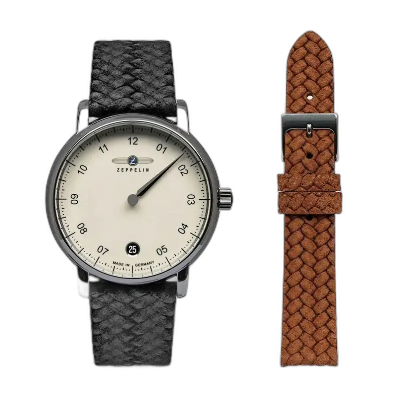 Zegarek Zeppelin New Captain’s Line 8643-5 z minimalistyczną, kremową tarczą i eleganckim paskiem w stylu plecionki w kolorze czarnym. W zestawie dodatkowy brązowy pasek pleciony, który umożliwia personalizację stylu. Precyzyjne wykonanie i niemiecka jakość, idealne na każdą okazję.