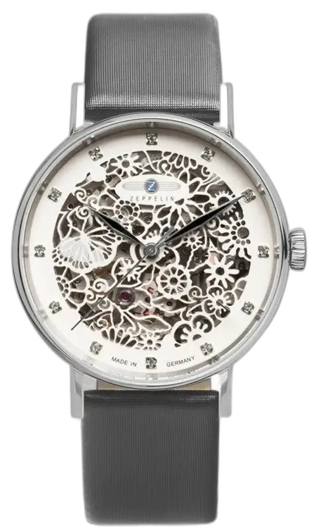 Elegancki zegarek Zeppelin Princess of the Sky 7461-1 z delikatnie zdobioną ażurową tarczą, ukazującą precyzyjne mechanizmy zegarka. Koperta wykonana ze stali szlachetnej oraz subtelne zdobienia kryształkami dodają luksusowego charakteru. Pasek w kolorze szarym doskonale komponuje się z designem tarczy, tworząc wyrafinowaną całość. Wyprodukowany w Niemczech, łączy estetykę z precyzją wykonania.